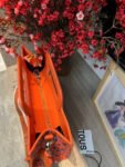 T0US medium shopper amaya coral manifesto 620034